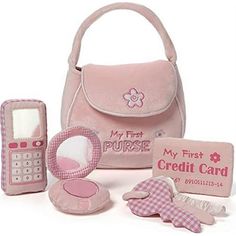 a pink purse, cell phone, and other items are shown in this image with the name my first purse on it