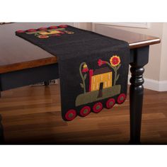 a table runner with a tractor design on it