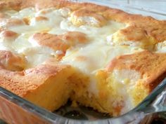 a casserole dish with cheese and bread in it on a glass plate, ready to be eaten