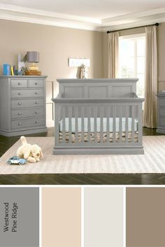 a baby's room with gray furniture and neutral colors