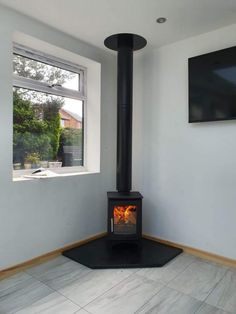 a wood burning stove in the corner of a room