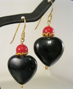 Wonderful vintage genuine black onyx and red coral gold filled drop or dangle pierced earrings.  They measure 1 1/2" long including the earring wires.  Unmarked but tested gold filled.  Total weight of the pair is 5.8 grams.  In excellent gently used vintage condition.  Please note, items in photos may appear larger than actual size. Be sure to read description for size and check all photos for comparison. 24207 ------------------------------------- Your item will arrive in a complimentary organza gift bag; OR, you can upgrade to our premium gift wrap design for only $3.00 extra which includes a beautiful gift box, candy, decoration, ribbon & gift card. Please be sure to check out my other shop where you can find custom personalized pocket watches and other gifts for everyone on your shopp Earring Wires, Coral And Gold, For Her Gifts, Heart Drop Earrings, Organza Gift Bags, Earrings Vintage, Pierced Earrings, Red Coral, Jewelry Vintage