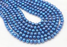 blue pearl beads on white background