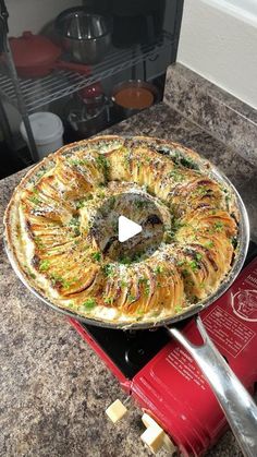 a pie sitting on top of a counter next to a knife