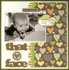 a scrapbook page with a baby in it's lap and hearts on the cover