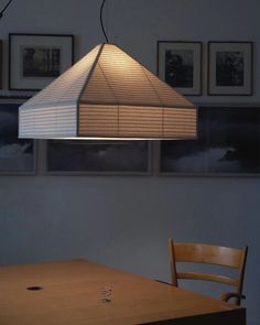 a table with a lamp hanging over it