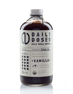 a bottle of vanilla coffee sits on a white surface