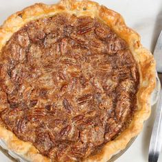 homemade pecan pie with text overlay that says homemade pecan pie on it