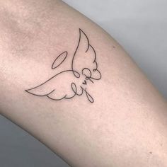 a tattoo on the arm of a woman with a dove in it's beak