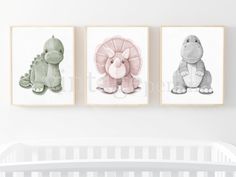 three children's wall art prints in pink, grey and white with dinosaurs on them