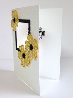 an open card with yellow flowers on it