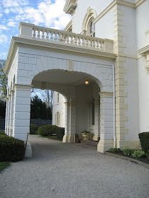 a large white building with an arched entrance