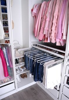 an organized closet with clothes and shoes