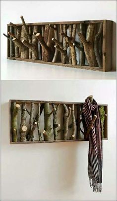 two wooden shelves with different types of branches on them, one is holding a scarf and the other has a coat rack