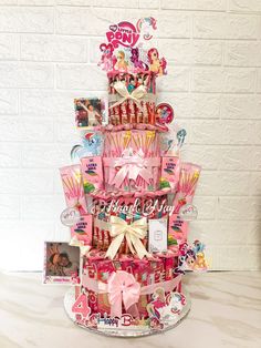 a pink cake with lots of candy on top