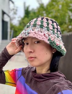 ♣. Handmade granny square chunky bucket hat, black + rainbow multi colors.  ♣. Total height: 8". Width: 13". Circumference: 21-23". ♣. Our products are designed to mold comfortably to your head and may naturally relax and stretch slightly over time with regular wear, enhancing their fit. ♣. Made from 80% acrylic, 20% wool chunky twisted yarn.  ♣. Hand wash ONLY. Spot Clean. Hang Dry.  ♣. All sales are FINAL, no returns nor exchanges. ---------------------------------------------------------------------------------------------------------------------------------- ♣. Each of our styles is one of a kind, crafted by hand with care. Please keep in mind that slight variations or subtle imperfections may occur--these are part of the beauty that makes every piece truly unique. If you have any ques Chunky Bucket Hat, Rainbow Bucket Hat, Granny Square Bucket Hat, Bucket Hat Black, Wool Hat, Hats Vintage, Granny Square, Caps Hats, Bucket Hat