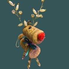 an animal made out of wine corks with jewels on it's antlers