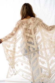 A bit of whimsy and lace makes this kimono the perfect layering piece! It features a shear fabric with lace and intricate embroidered details throughout. Model is 5'4" and wearing a one size. 100% Polyester OS sizing fits most* sizes US 0-18Size : 45" x 48"Armhole : 9" Import Ceremonial Clothing, Three Bird Nest, Lace Sleeve Top, Boho Chic Style, Lace Kimono, Embroidered Details, Lace Making, Bird Nest, Beach Wedding Dress