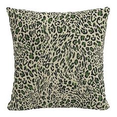 a leopard print pillow with green spots on the front and back, sitting on a white background