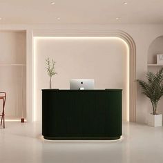 a white room with a green reception desk