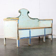 an old blue and white painted bed frame