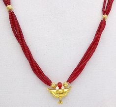 Vintage design 20kt yellow gold handmade gorgeous amulet pendant necklace with 2 gold beads strung between Red color beads(imitation beads), the screw clasp is metal(alloy), excellent tribal jewelry from rajasthan indiaMetal-20kt yellow gold.Brand-traditional-jewellery.Gross weight-12.240 grams approx.Width of pendant-2.1 cm approx.Height of pendant-1.5 cm with hanging bells.length-18 inches.(can be customize as your order)Note- Red stone is lab created beads.and back screw is alloy metal Red 22k Gold Temple Necklace For Celebration, Spiritual Gold Kundan Necklace With Polished Beads, Traditional 22k Gold Red Temple Necklace, Traditional Red 22k Gold Temple Necklace, Traditional Gold Necklaces With Tiny Beads, Spiritual 22k Gold Kundan Necklace For Festivals, Gold Kundan Necklace With Dangling Beads, Yellow Gold Temple Necklace With Round Beads For Puja, Traditional Gold Necklace With Tiny Beads