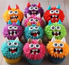 cupcakes with colorful frosting decorated like monsters