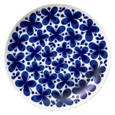 a blue and white plate with flowers on it