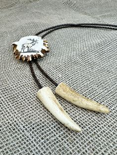 Please note: Every antler is unique, ensuring that no two bolo ties are exactly alike. The bolo tie you receive may differ from the photo, showcasing the natural variations and distinct charm of each piece. Embrace the individuality and spirit of nature with this one-of-a-kind, timeless jewelry. Unlock the essence of strength, courage and goodluck with our original antler bolo ties. This original antler bolo tie is outstanding accesory. Can be perfect gift for best friend, boyfriend, brother, husband, father, grandfather, cooworker, boss. Our bolo ties are more than just accessories - they embody the powerful symbolism of antlers, representing strength, courage, and the cyclical nature of life. Adorn yourself or a loved one with a talisman that brings good luck and protective energies. - U Christmas Gift For Husband, Deer Antler Ring, Best Friend Boyfriend, Antler Jewelry, Antler Ring, Horn Jewelry, Bolo Ties, Deer Print, Bolo Tie