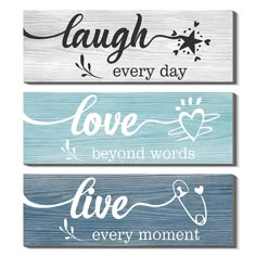 three wooden signs that say laugh every day, love beyond words and live every moment