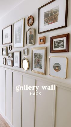 there are many pictures on the wall and frames above it, along with other things