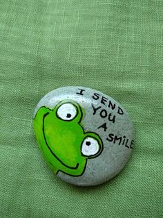 a green frog with the words i send you a smile on it