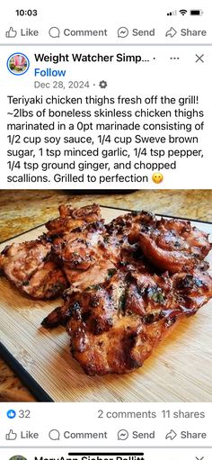 a wooden cutting board topped with meat on top of a table