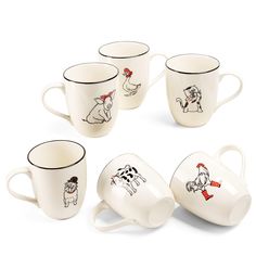 four coffee cups with dogs on them and one has a red bow around its neck