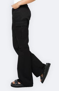 COLOR: BLACK DETAILS High rise Bootcut leg Relaxed fit Front zipper and button fastening Belt loops at waist Utility pocket design 100% Cotton Please refer to the care label for garment care instructions SIZE & FIT: runs TTS, model wears size S MODEL INFO: HEIGHT 5’8, WAIST 24in, BUST 32in Fitted Black Utility Cargo Pants, Workwear Pants With Side Pockets, Black Techwear Work Pants With Pockets, Black Utility Work Pants, Fitted Urban Black Cargo Pants, Urban Fitted Black Cargo Pants, Black Straight Leg Cargo Pants With Side Pockets, Fitted Black Cargo Pants With Zip Fly, Black Techwear Work Pants With Multiple Pockets