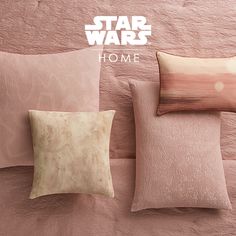 star wars themed pillows and pillow cases against a pink wall with the words home written on it