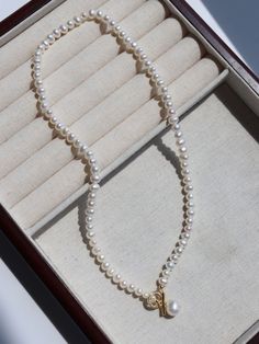 Elevate your style with the understated glamour of our Natural Freshwater Pearl Zircon OT Buckle Necklace—a refined and sophisticated accessory that seamlessly combines lustrous freshwater pearls with the sparkle of zircon in an elegant OT buckle design. Metal: 18K Recycled Gold Plated On Brass Pearl: Freshwater Pearl Chain Length: 400/450mm Refined Gold Pearl Necklace With Charm, Pearl White Necklace With Pearl Charm, Timeless Style, Timeless Pearl Necklace With Pearl Charm, Timeless Pearl White Necklace With Pearl Charm, Timeless Yellow Gold Pearl Necklace With Charm, Classic Pearl Pendant Necklace For Everyday Luxury, Refined Yellow Gold Pearl Necklace With Charm, Everyday Yellow Gold Pearl Necklace, Timeless Akoya Pearl Necklace With Pearl Charm