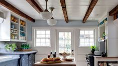 the kitchen is clean and ready to be used for cooking or baking, while also being used as a dining area