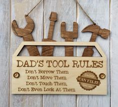 a wooden sign that says dad's tool rules don't throw them don't touch them don't even look at them