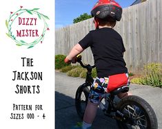 a little boy riding a bike with the words dizzy mister on it's back