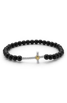 A crisscross band of 18-karat gold drapes over the sterling silver Caviar beads that form the statement-making cross on this bold stretch bracelet made from smooth onyx beads. 8 1/2"–8 3/4" inner circumference Onyx/sterling silver/18k gold Imported Gold Drapes, Onyx Bead, Fabric Gift Bags, Mens Jewelry Bracelet, Beaded Stretch Bracelet, Keep Jewelry, Stretch Bracelet, Stretch Bracelets, Bracelet Making