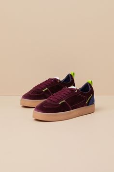 Take your trendy look up a notch with the Steve Madden Tucker Burgundy Multi Velvet Flatform Lace-Up Sneakers! These style-forward kicks have a soft velvet construction (in hues of dark burgundy and navy) that shapes a classic rounded upper and a lace-up vamp (with matching burgundy laces). Contrasting neon green stitching runs throughout, while a matching pull tab sprouts from the heel. Low-cut, padded collar sits atop a chunky gum sole for a sporty finish! 1. 25" rubber heel. Lightly cushioned Burgundy Lace-up Sneakers For Sports, Luxury Burgundy Low-top Sneakers, Green Vulcanized Sole Lace-up Platform Sneakers, Burgundy Lace-up Sneakers With Rubber Sole, Red Lace-up Sneakers With Textured Sole, Flatform Sneakers, Burgundy Lace, Flat Sneakers, Rubber Heels