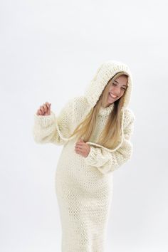 "Make a definite statement with your style with our wool hoodie sweater dress. Crafted from high quality wool , that's comfortable and elegant at the same time, this design has a distinctive and stylish appeal. DETAILS - Made from 100% Natural Premium wool 2.5 kg 3 strands -100 % handmade knit ,our own production - Hoddie dress - The model is 170 cm tall (regular S) - The sweater on picture is size XL - As mostly all models in our shop the sweater is loose fit - Color on photo - beige See our co Cozy Knitted Spring Dresses, Fitted Cozy Sweater Dress For Winter, Knitted Long Sleeve Winter Dress, Cozy Knitted Sweater Dress For Fall, Fitted Knit Hooded Sweater, Long Knitted Winter Dress, Cozy Knitted Winter Dresses, Cream Knitted Dress For Fall, Cozy Fitted Winter Dresses