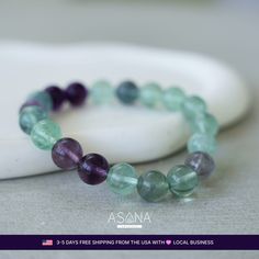 Illuminate your path with the Colorful Fluorite Beaded Bracelet by Asana Crystals. Each 10mm round bead of natural Colorful Fluorite radiates harmony, balance, creativity, intuition, and transformation. Let this vibrant masterpiece be your guide to self-discovery, joy, and spiritual growth.                	Crystal: Natural Colorful Fluorite  	Type: Beaded Stretch Bracelet  	Bead Size: 10 MM  	Bracelet Size: 7 Inches  	Wrist Size Range: 6 to 7  	Bead Shape: Round  	Closure: None  	Other Mate Holistic Round Beaded Bracelets For Meditation, Holistic Beaded Bracelets For Meditation, Holistic Healing Beaded Bracelets, Holistic Stretch Bracelet With 8mm Beads For Healing, Adjustable Fluorite Bracelets For Healing, Spiritual Fluorite Bracelets For Healing, Fluorite Gemstone Bracelets With Round Beads, Gemstone Stretch Bracelet For Meditation, Spiritual Fluorite Bracelet For Healing