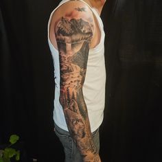 a man with a sleeve tattoo on his arm