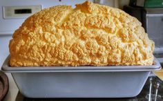 a loaf of bread sitting on top of a metal pan