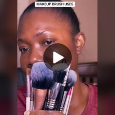 a woman holding up makeup brushes in front of her face with the words makeup brush uses