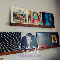 three wooden shelves with pictures on them and the words diy display shelves above them