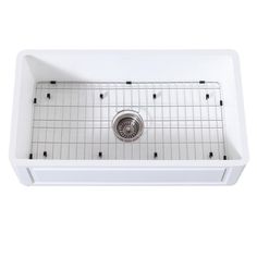 a white kitchen sink with grids on the bottom and drain in the middle, against a white background