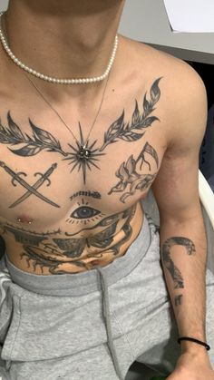 a man with many tattoos on his chest